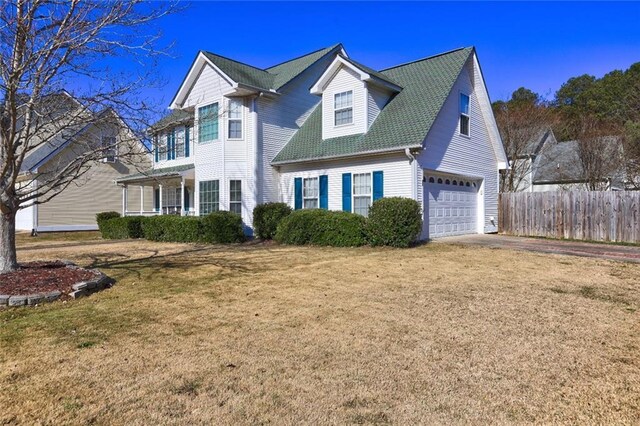 view of front of property with a porch, central AC, and a front lawn