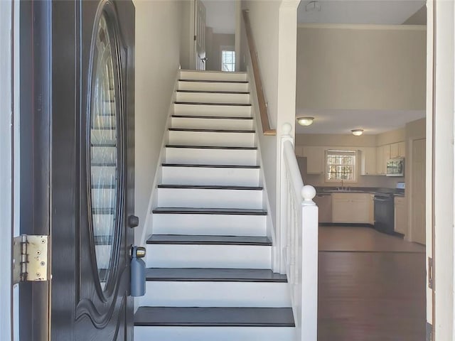 stairway with crown molding