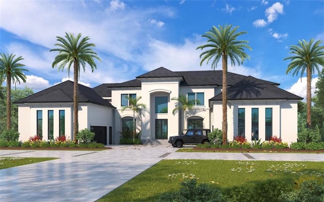 view of front of home featuring a garage and a front lawn