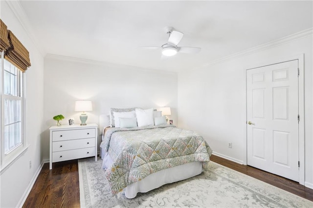 bedroom featuring wood finished floors, baseboards, and ornamental molding