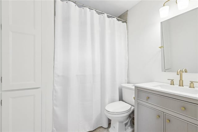 full bathroom with vanity, a shower with shower curtain, and toilet