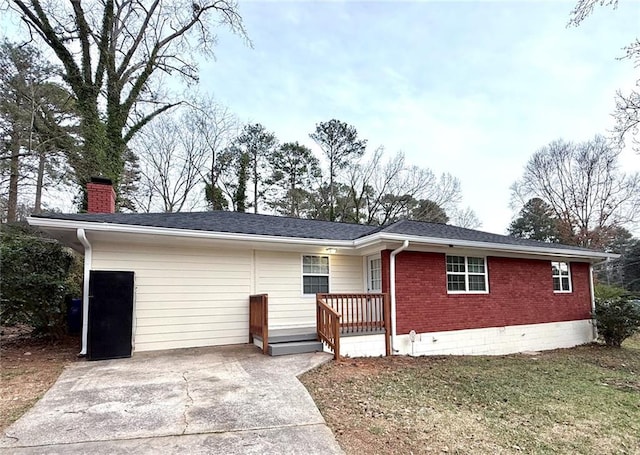 2182 Rosewood Rd, Decatur, GA 30032 - single story home with concrete driveway, brick siding, a chimney, and a shingled roof