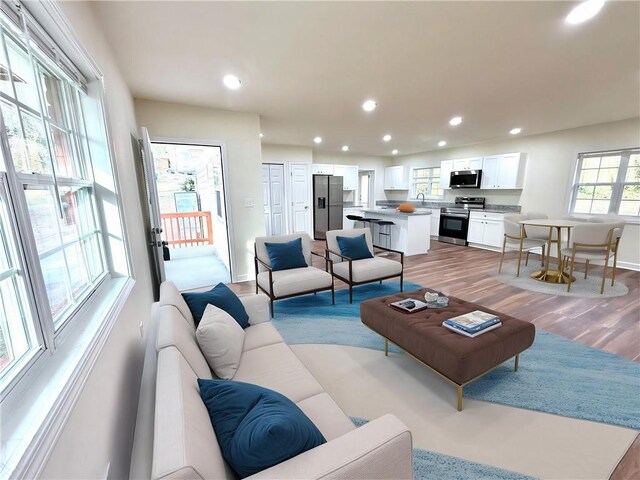 2182 Rosewood Rd, Decatur, GA 30032 - living room with baseboards, recessed lighting, and light wood-style flooring