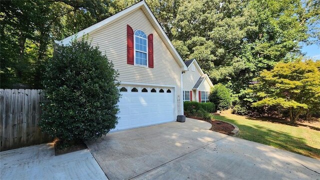 view of property exterior with a garage