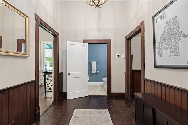 161 N Barton St, Norcross, GA 30071 - foyer featuring a wainscoted wall, dark wood-style floors, a high ceiling, and wooden walls