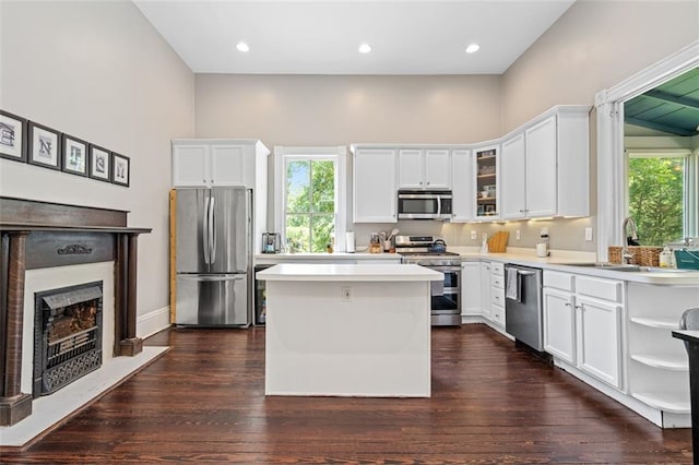 161 N Barton St, Norcross, GA 30071 - kitchen with appliances with stainless steel finishes, plenty of natural light, white cabinets, and recessed lighting