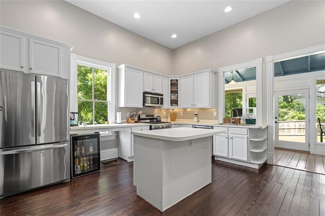 161 N Barton St, Norcross, GA 30071 - kitchen featuring appliances with stainless steel finishes, wine cooler, dark wood-type flooring, light countertops, and recessed lighting