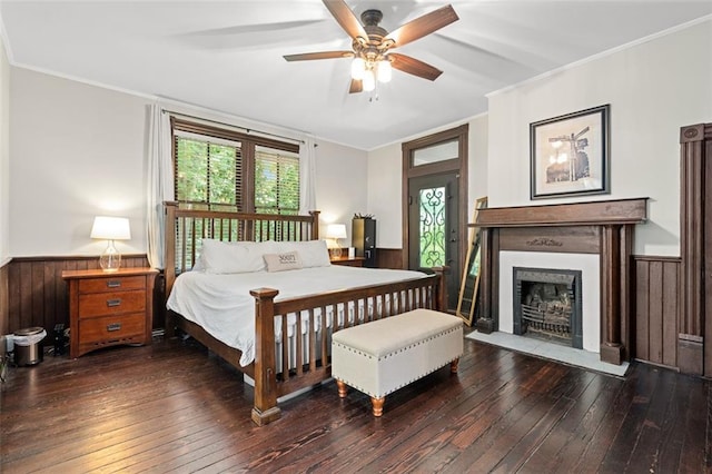 161 N Barton St, Norcross, GA 30071 - bedroom featuring wainscoting, hardwood / wood-style flooring, ornamental molding, a fireplace with flush hearth, and wood walls