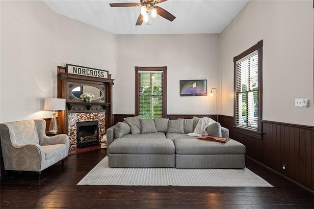 161 N Barton St, Norcross, GA 30071 - living room featuring wainscoting, hardwood / wood-style flooring, ceiling fan, a fireplace, and wood walls