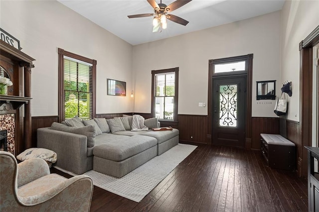161 N Barton St, Norcross, GA 30071 - living room featuring a wainscoted wall, wooden walls, ceiling fan, dark wood-style floors, and a fireplace