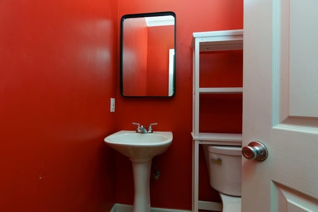 bathroom with sink and toilet