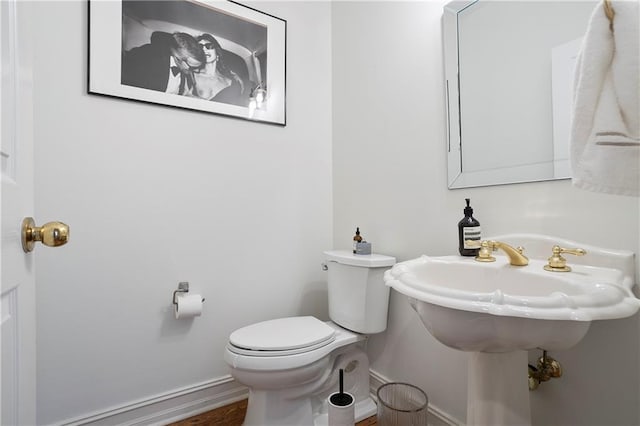 12160 Oak Hollow Way, Alpharetta, GA 30005 - half bathroom with toilet and wood finished floors