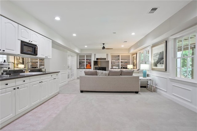 12160 Oak Hollow Way, Alpharetta, GA 30005 - living area with ceiling fan, light colored carpet, and recessed lighting