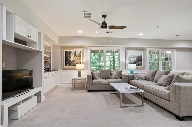 12160 Oak Hollow Way, Alpharetta, GA 30005 - living room with a ceiling fan, healthy amount of natural light, built in features, light colored carpet, and recessed lighting