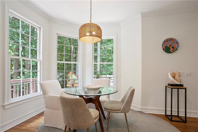 12160 Oak Hollow Way, Alpharetta, GA 30005 - dining area featuring healthy amount of natural light, dark wood-type flooring, and crown molding