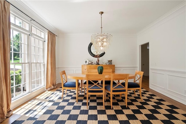 12160 Oak Hollow Way, Alpharetta, GA 30005 - dining area with plenty of natural light, a chandelier, ornamental molding, wood finished floors, and wainscoting