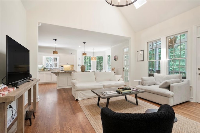 12160 Oak Hollow Way, Alpharetta, GA 30005 - living area with wood finished floors and high vaulted ceiling