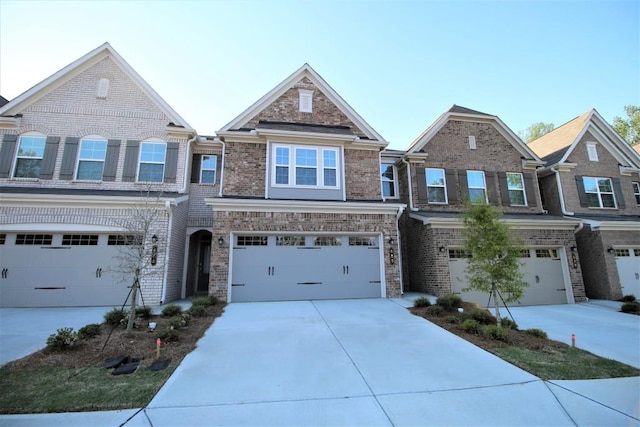 view of front facade featuring brick siding, concrete driveway, and an attached garage