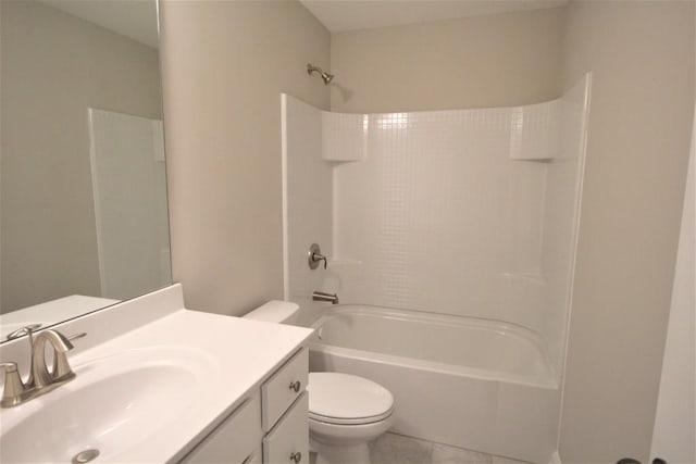 full bathroom featuring tub / shower combination, toilet, vanity, and tile patterned flooring