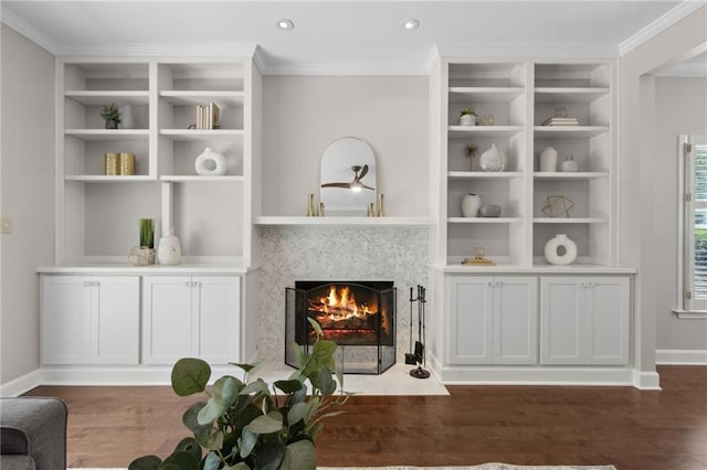 812 Dixie Ave NE, Atlanta, GA 30307 - living area with a fireplace with flush hearth, crown molding, wood finished floors, recessed lighting, and built in shelves