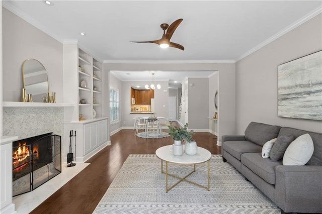 812 Dixie Ave NE, Atlanta, GA 30307 - living area with wood finished floors, crown molding, a chandelier, a premium fireplace, and ceiling fan