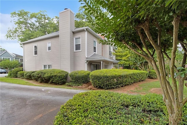 812 Dixie Ave NE, Atlanta, GA 30307 - view of side of home with a chimney