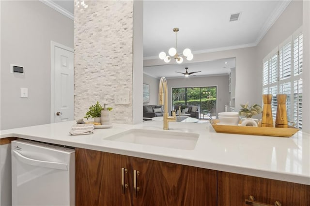 812 Dixie Ave NE, Atlanta, GA 30307 - kitchen featuring white dishwasher, crown molding, light countertops, a chandelier, and decorative light fixtures