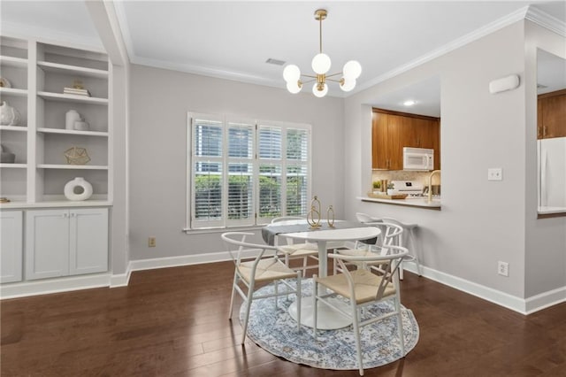 812 Dixie Ave NE, Atlanta, GA 30307 - dining room featuring ornamental molding, dark wood finished floors, a chandelier, and built in features