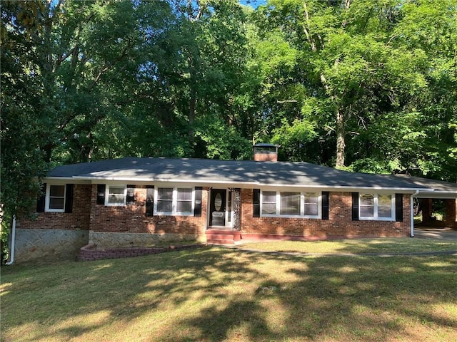 ranch-style house with a front yard and a carport