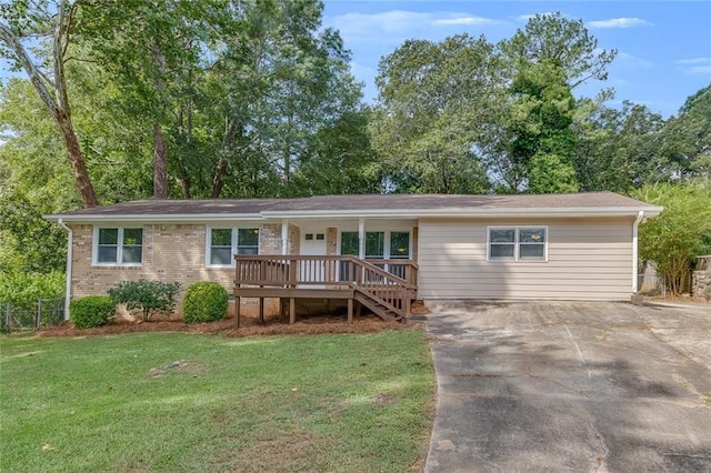 ranch-style home with a front lawn