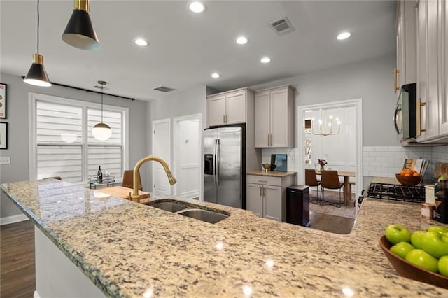 1744 Habershal Rd NW, Atlanta, GA 30318 - kitchen with appliances with stainless steel finishes, a sink, dark wood-style flooring, decorative backsplash, and recessed lighting