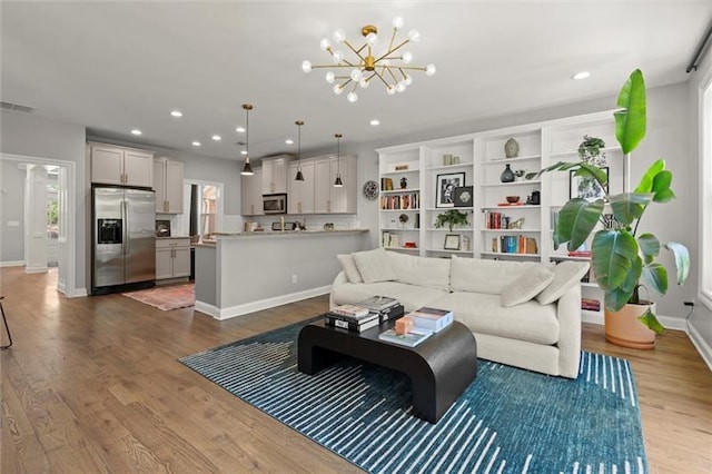 1744 Habershal Rd NW, Atlanta, GA 30318 - living room featuring dark wood-style flooring, a chandelier, recessed lighting, and baseboards