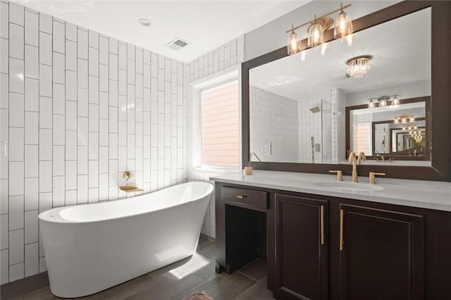 1744 Habershal Rd NW, Atlanta, GA 30318 - bathroom featuring a soaking tub, vanity, tiled shower, tile walls, and tile patterned floors