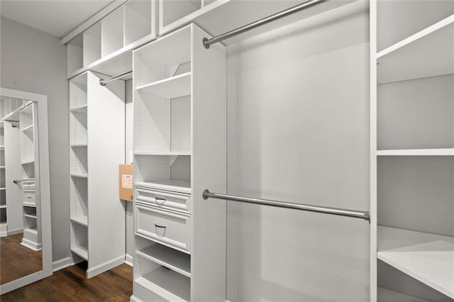1744 Habershal Rd NW, Atlanta, GA 30318 - walk in closet featuring dark wood-style floors