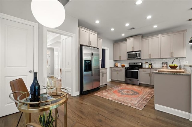 1744 Habershal Rd NW, Atlanta, GA 30318 - kitchen with stainless steel appliances, decorative backsplash, dark wood-style flooring, and recessed lighting