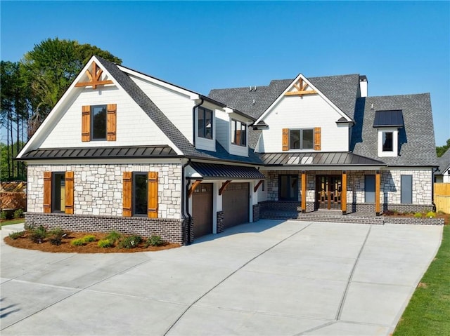 modern farmhouse style home with a porch and a garage