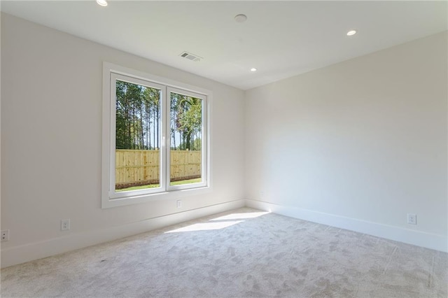 empty room featuring light colored carpet