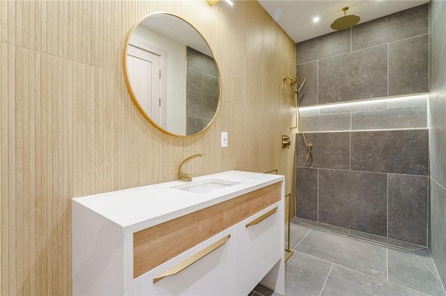 bathroom with a shower and vanity