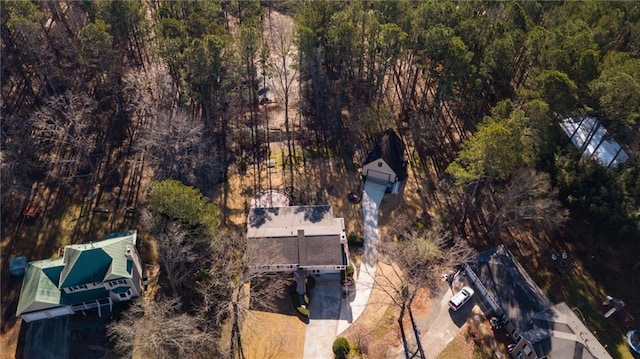 birds eye view of property with a wooded view