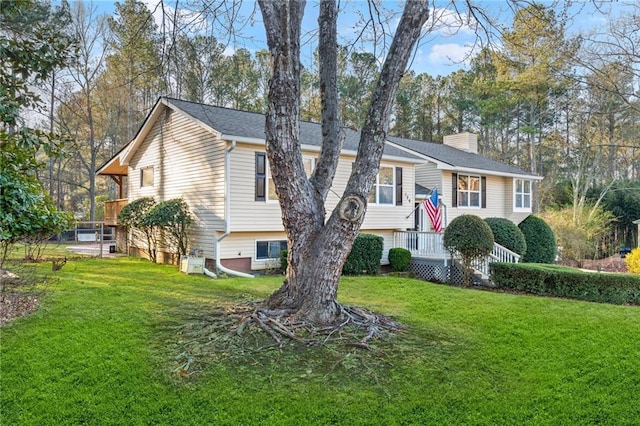 view of front of home featuring a front yard and a chimney