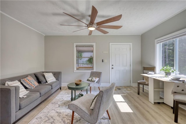 1149 Avondale Ave SE, Atlanta, GA 30312 - living room with a ceiling fan, light wood-style flooring, ornamental molding, and baseboards