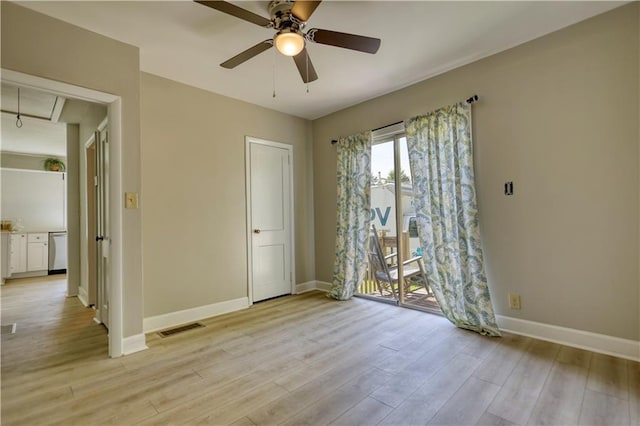 1149 Avondale Ave SE, Atlanta, GA 30312 - unfurnished bedroom with attic access, light wood finished floors, baseboards, and ceiling fan