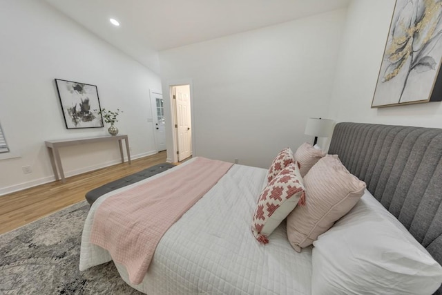 bedroom with hardwood / wood-style floors