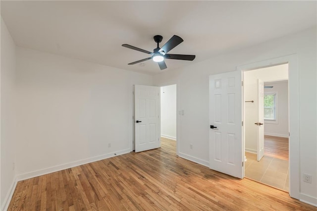 unfurnished bedroom with light hardwood / wood-style floors and ceiling fan