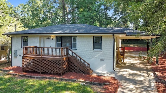 rear view of house with a wooden deck