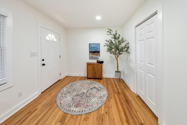 entryway with hardwood / wood-style flooring