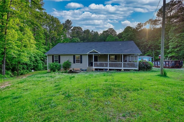 160 Riverbrooke Trl, Covington, GA 30016 - rear view of property featuring covered porch, a yard, and roof with shingles