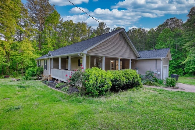 160 Riverbrooke Trl, Covington, GA 30016 - view of home's exterior featuring covered porch, a garage, a yard, asphalt driveway, and a shingled roof