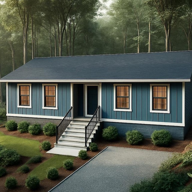 137 Cheyenne Trl, Martin, GA 30557 - view of front facade with board and batten siding and a shingled roof