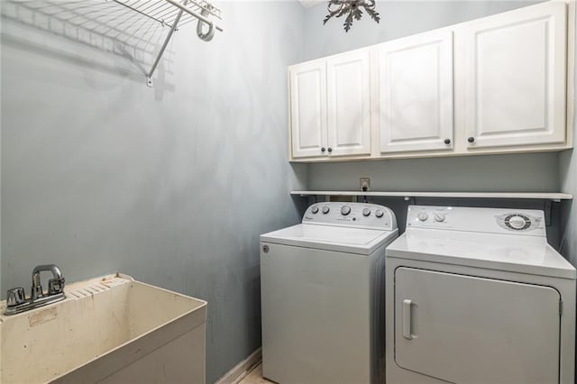 laundry room featuring cabinet space and washing machine and dryer